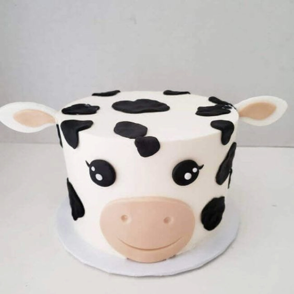 Playful Spotted Cow Character Cake